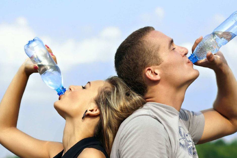 Photo showing man and woman drinking water