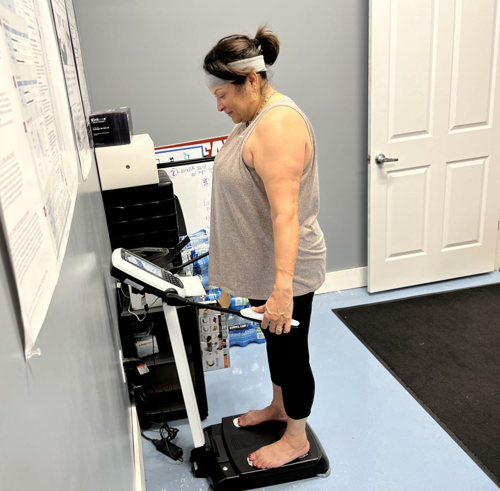 woman standing on InBody Composition scale