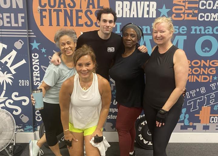 55+ seniors posing for group photo at Coastal Fitness