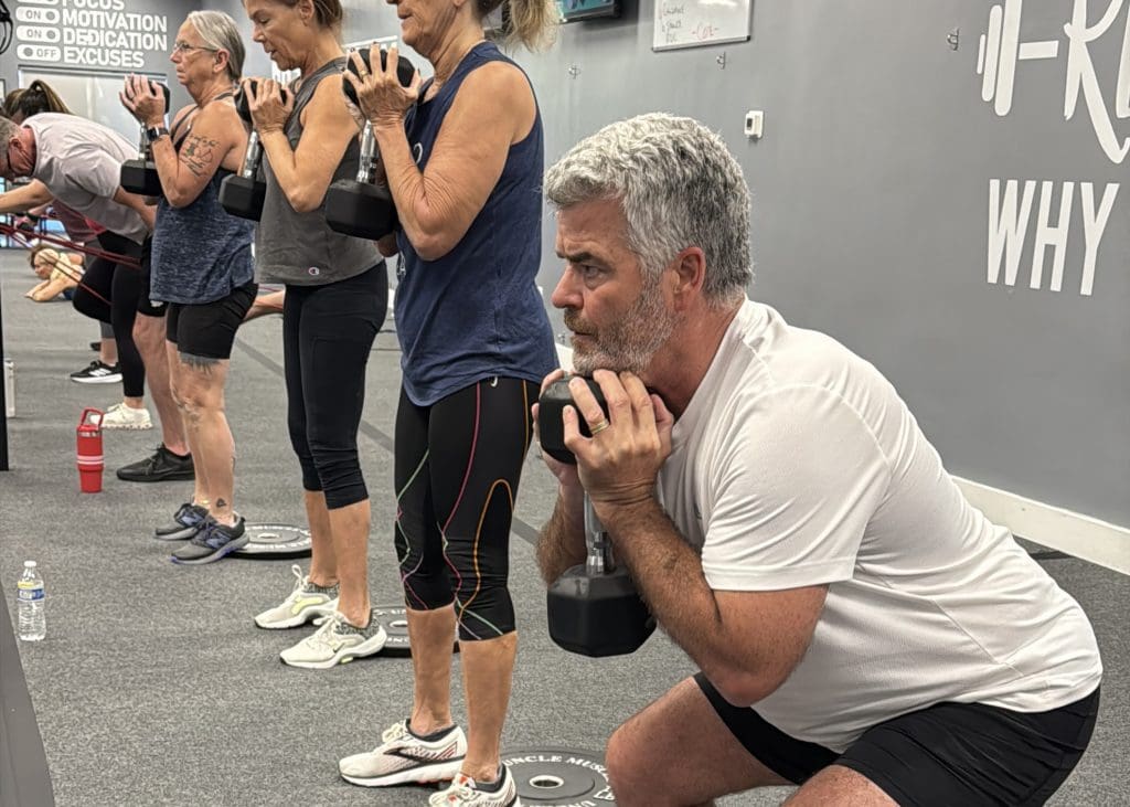 Members of Coastal Fitness strength training