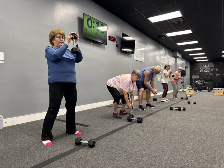 55 and older members strength training at Coastal Fitness