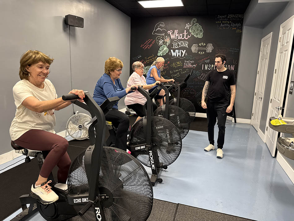55 and older members resistance training at Coastal Fitness