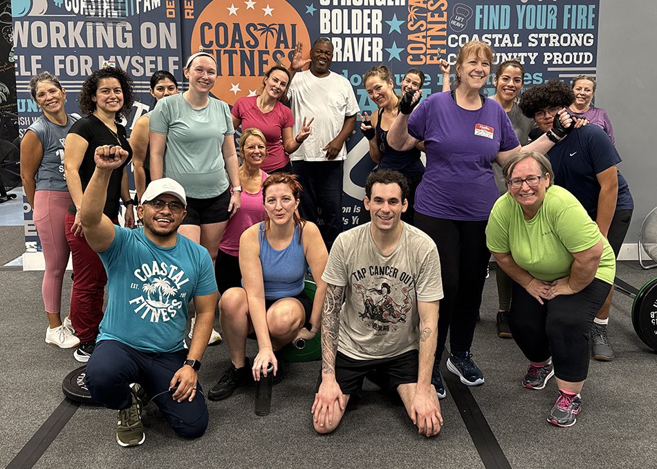 Coastal Fitness members posing for a group photo after strength training