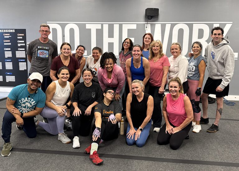 Coastal Fitness members posing for a group photo after strength training