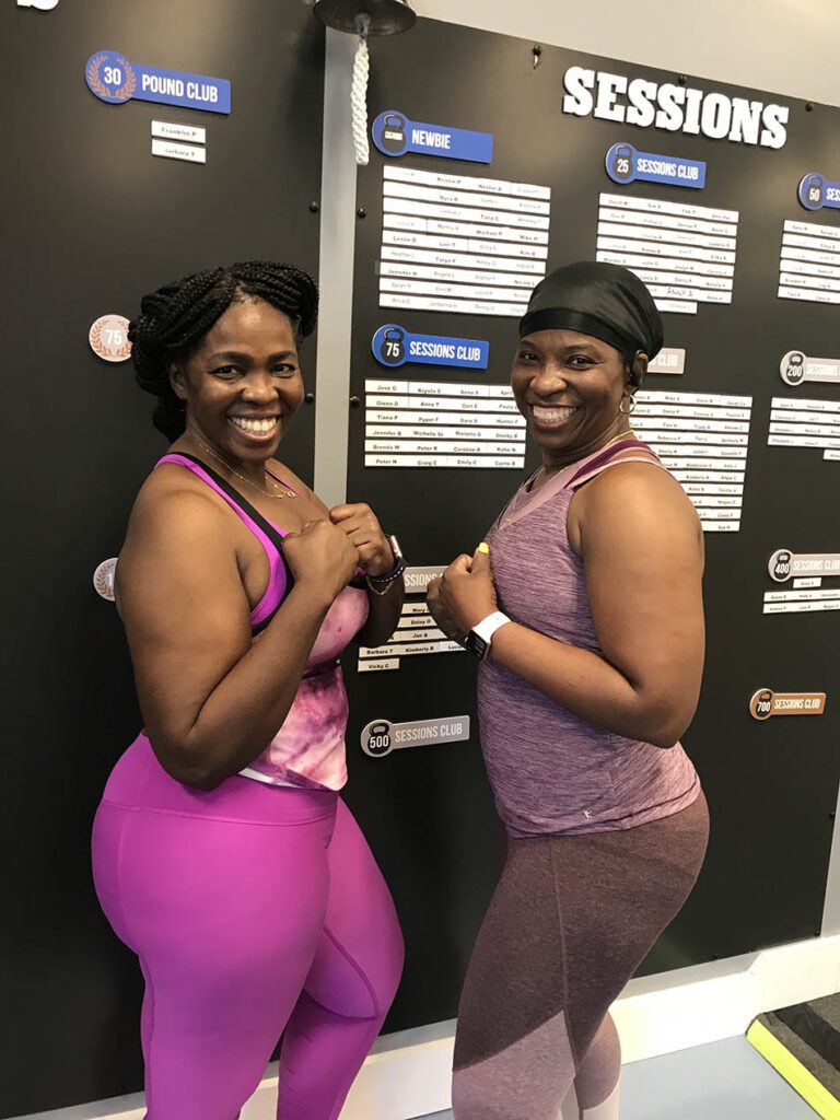 Members of Coastal Fitness posing for photo after a tough workout.