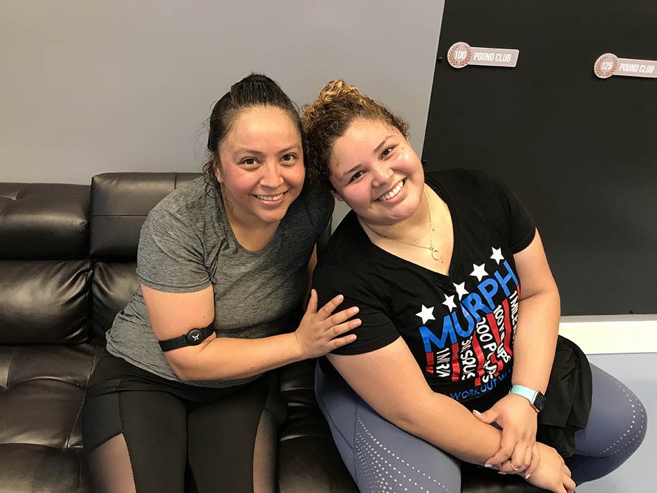 Members of Coastal Fitness posing for photo after a tough workout.
