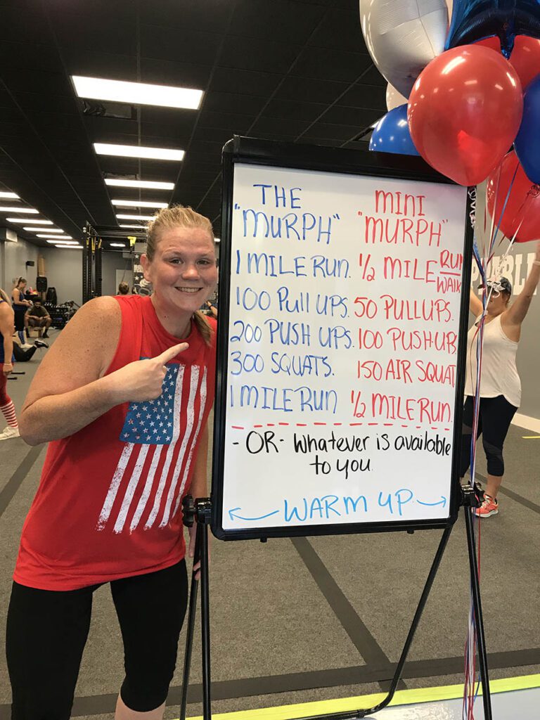 Members of Coastal Fitness posing for photo after a tough workout.