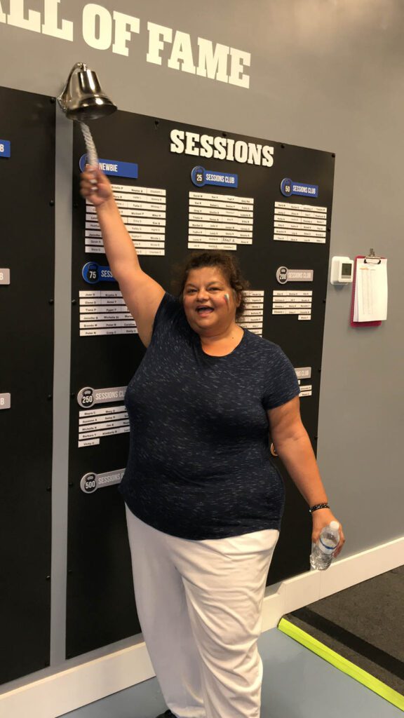 Members of Coastal Fitness posing for photo after a tough workout.