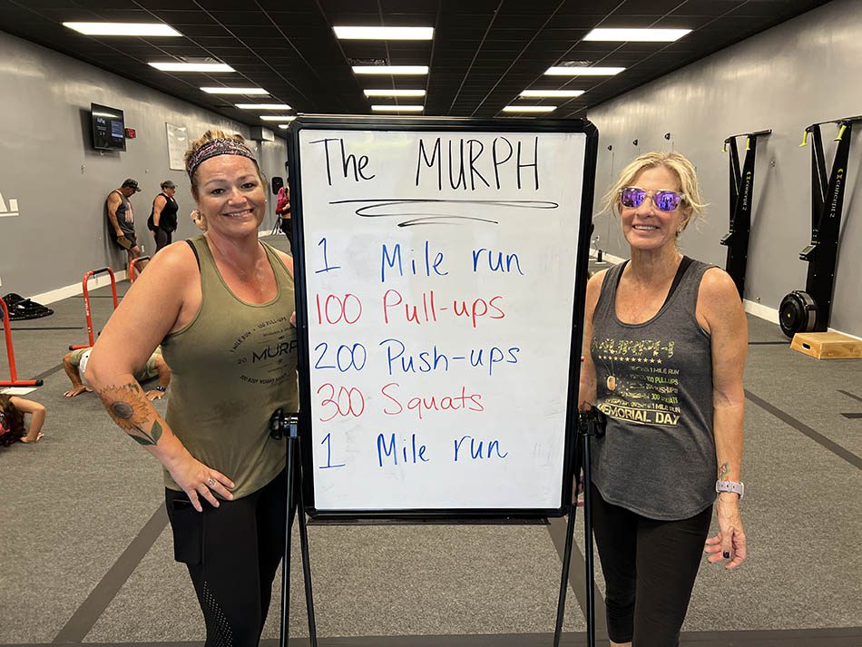 Members of Coastal Fitness posing for photo after a tough workout.