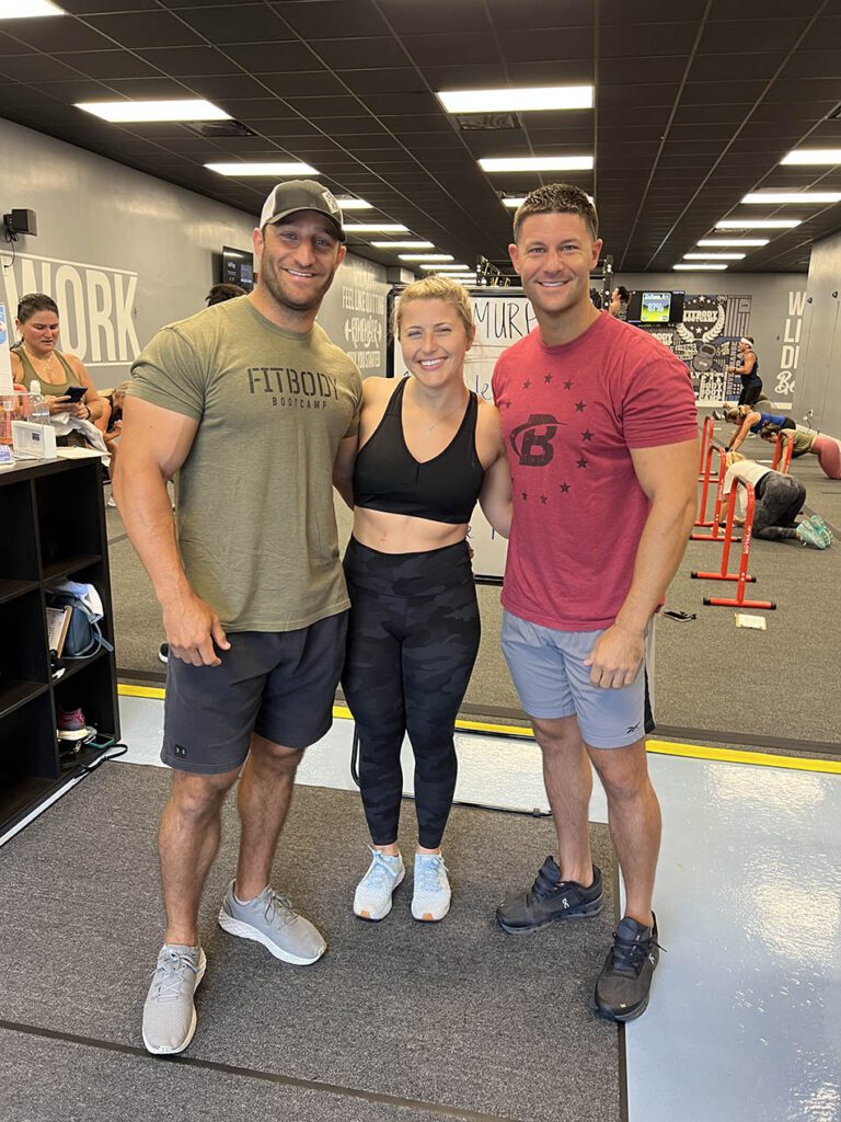 Members of Coastal Fitness posing for photo after a tough workout.
