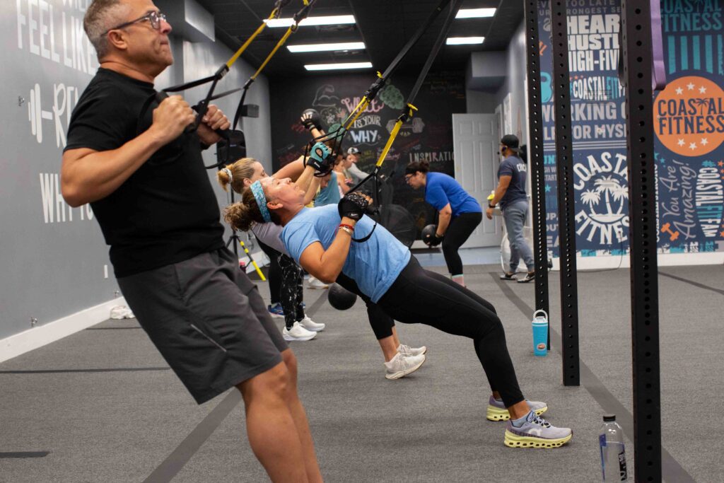 55 and older members strength training at Coastal Fitness