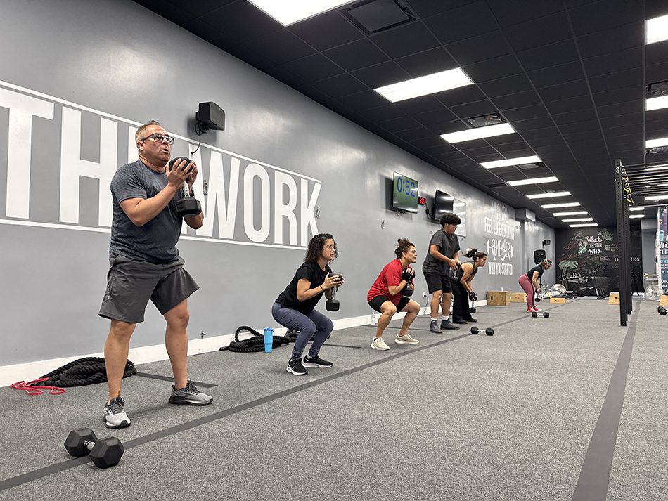 55 and older members strength training at Coastal Fitness