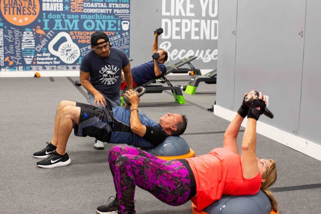 55 and older members strength training at Coastal Fitness