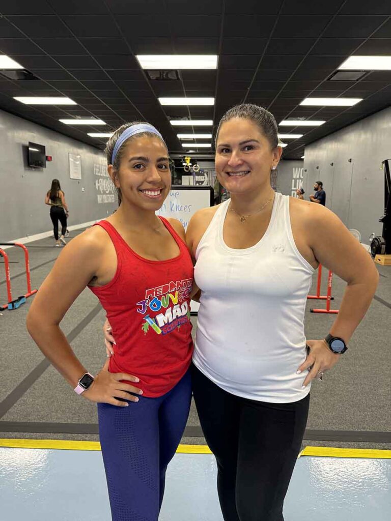 Members of Coastal Fitness posing for photo after a tough workout.