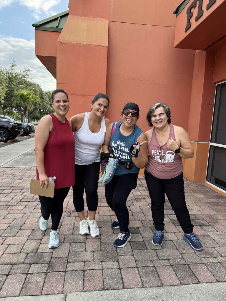 Members of Coastal Fitness posing for photo after a tough workout.