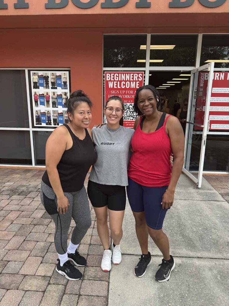 Members of Coastal Fitness posing for photo after a tough workout.