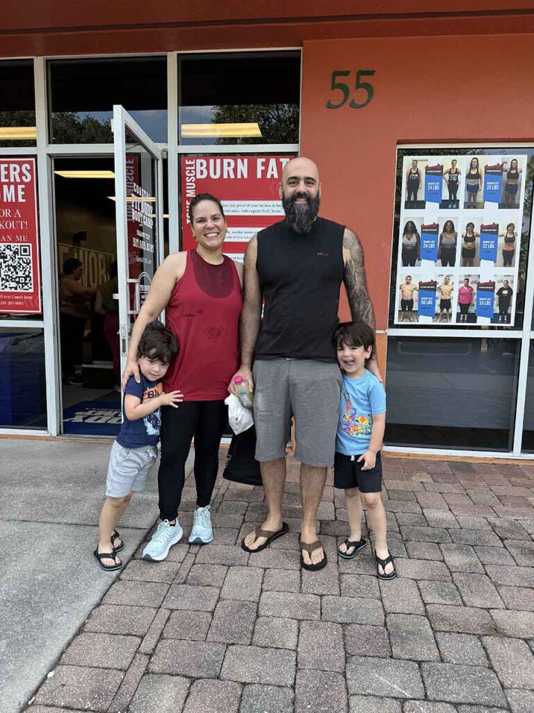 Members of Coastal Fitness posing for photo after a tough workout.