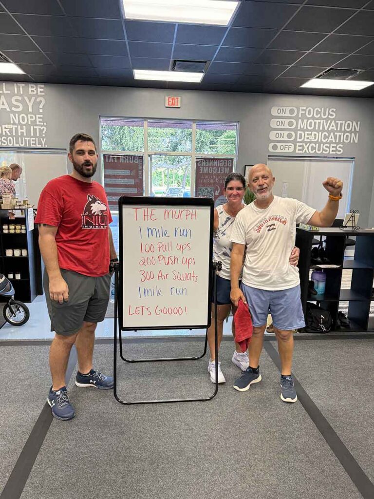 Members of Coastal Fitness posing for photo after a tough workout.