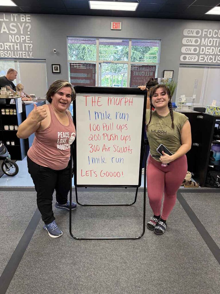 Members of Coastal Fitness posing for photo after a tough workout.