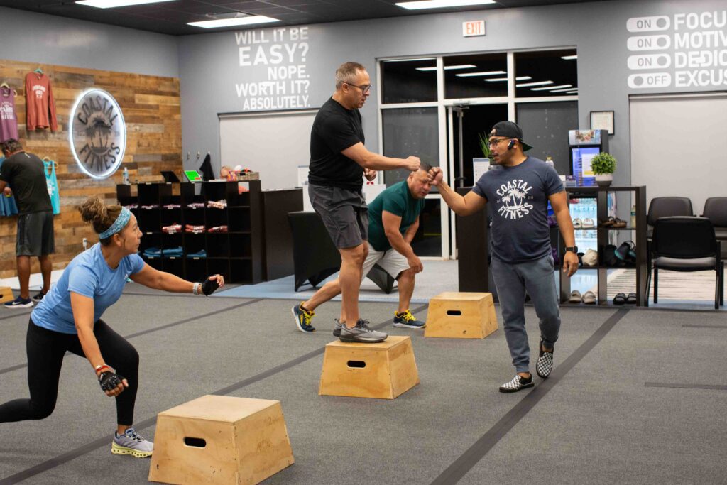 55 and older members strength training at Coastal Fitness