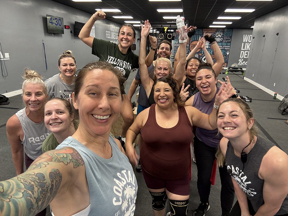Coastal Fitness members posing for a group photo after strength training