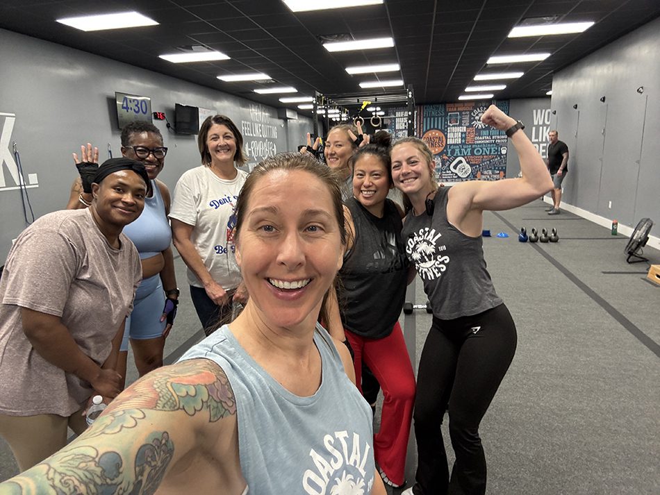 Coastal Fitness members posing for a group photo after strength training